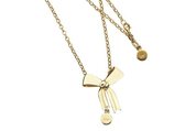9k yellow gold karen walker bow necklace